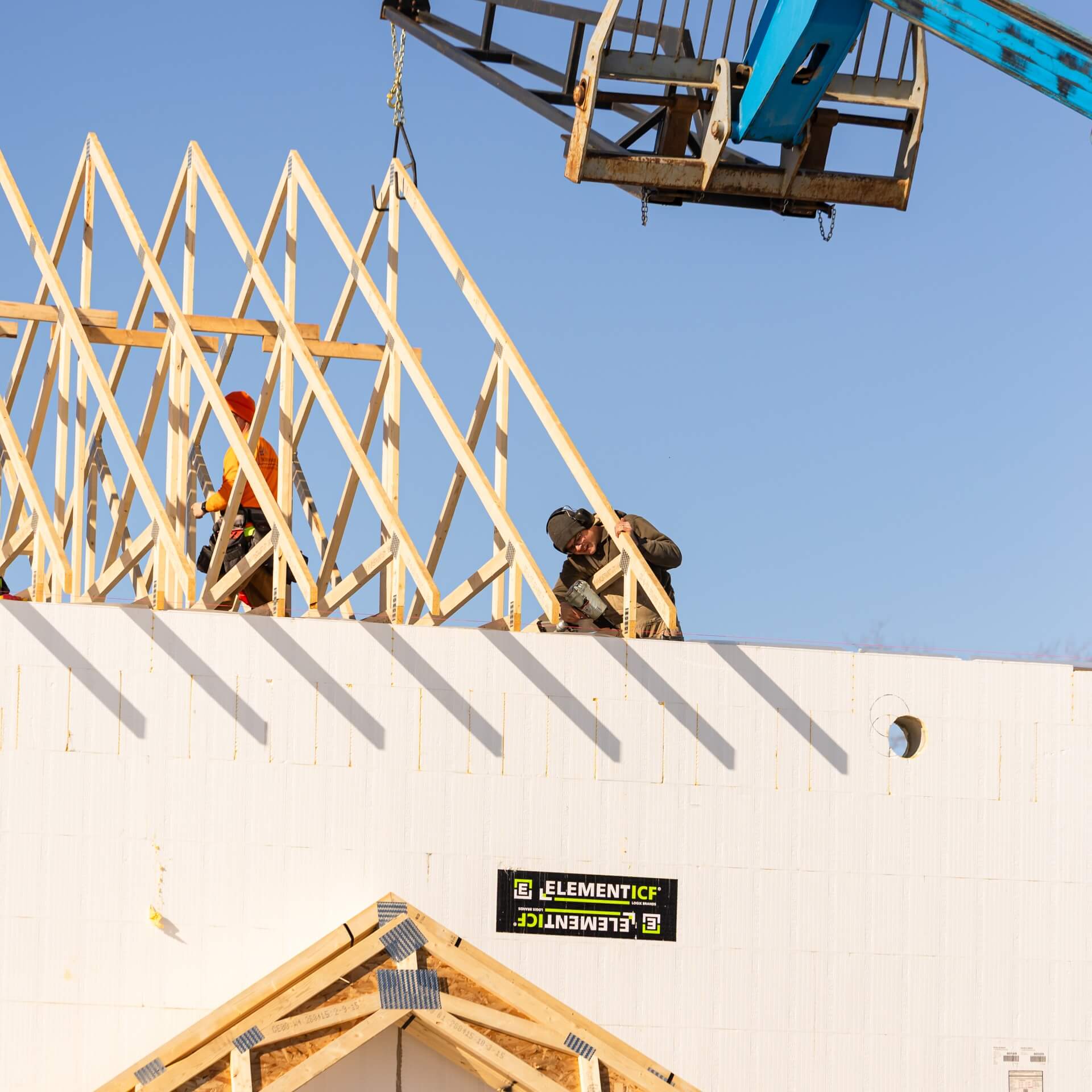 Roof framing being installed above Element ICF walls